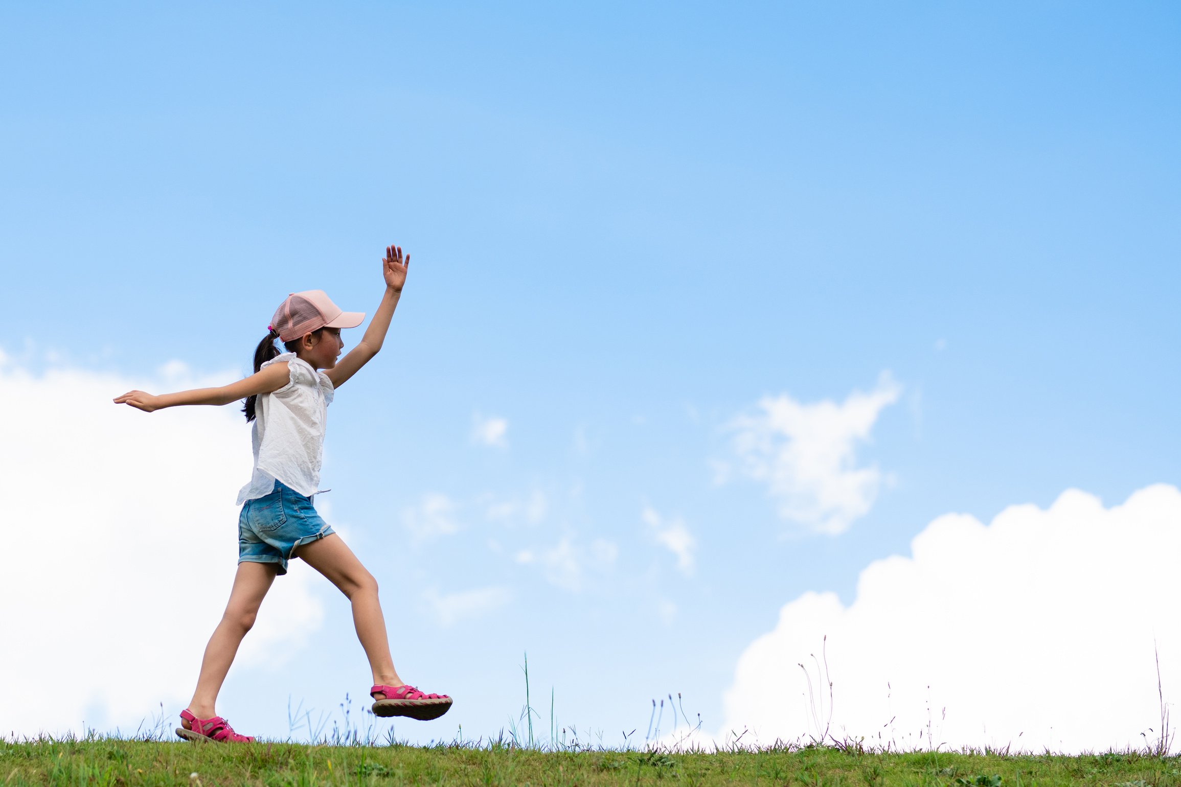 Child walking in the meadow